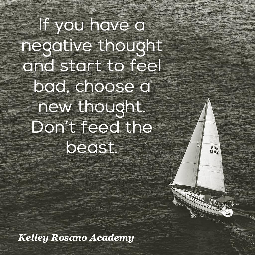 Sailboat on ocean with motivational quote overlay
