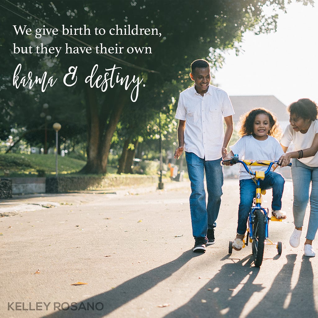 Parents teaching child to ride bicycle
