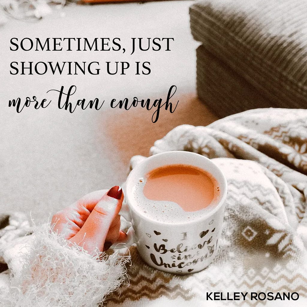 Cozy hand holding mug on blanket, motivational quote
