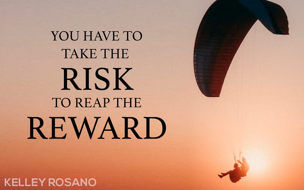 Paraglider silhouette at sunset with motivational quote
