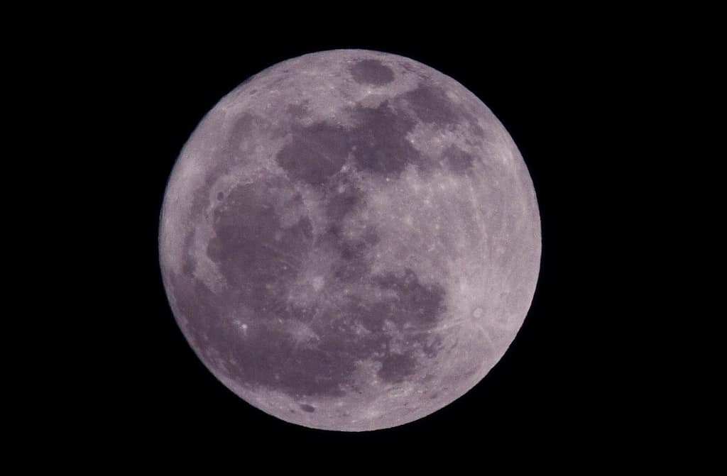 Close-up full moon with purple tint