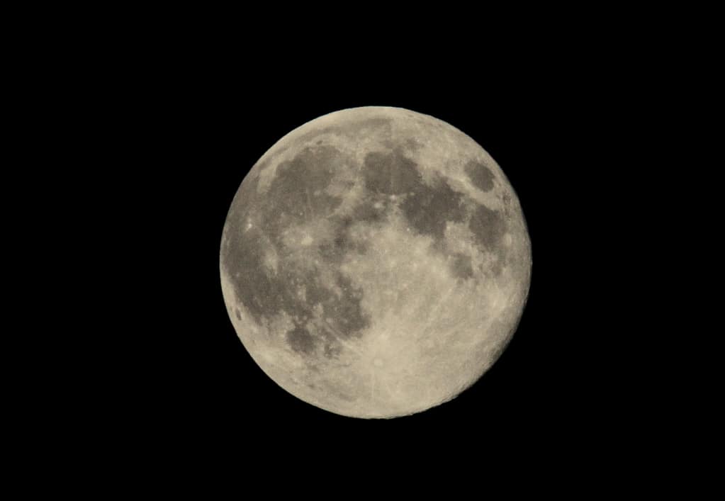 Full moon against black night sky
