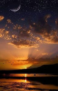 Crescent moon and stars over golden sunset lake
