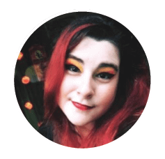 Portrait of woman with red hair, bold makeup