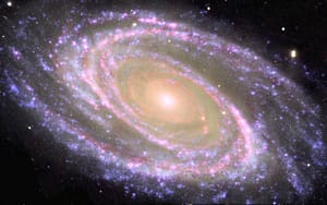 Colorful spiral galaxy with glowing central bulge
