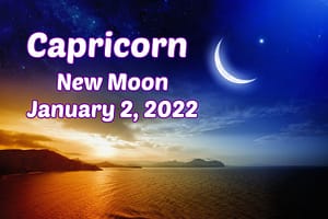 Capricorn new moon over ocean at sunset