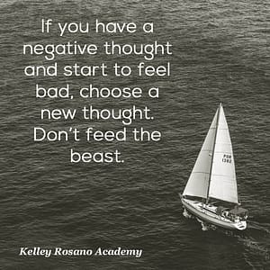 Sailboat on ocean with motivational quote overlay