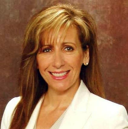 Professional headshot of smiling woman