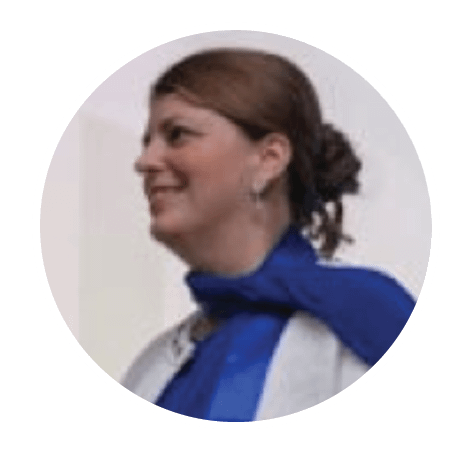 Smiling woman in profile wearing blue scarf