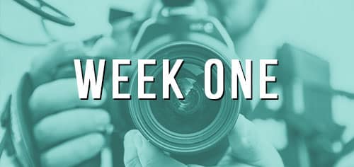 Close-up camera lens with "Week One" text