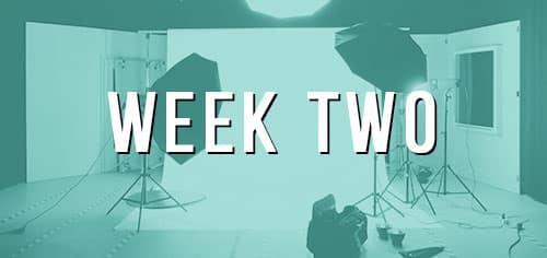 Studio lighting setup with bold "WEEK TWO" text