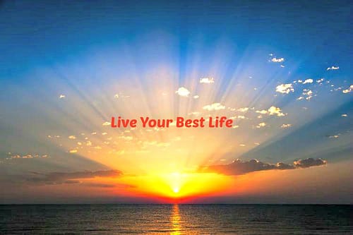 Sunrise over ocean with "Live Your Best Life