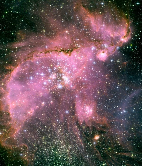 Pink star-forming nebula with sparkling stars