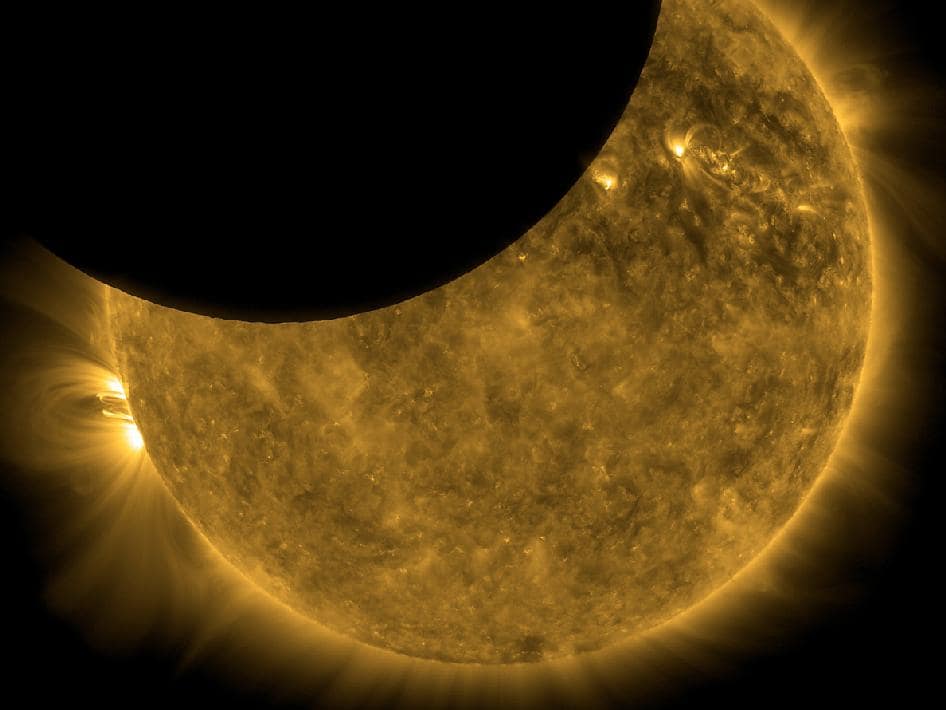 Partial solar eclipse showing sun's glowing corona